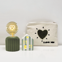 lampe en ciment vert avec ampoule coeur opjet vanille concept store